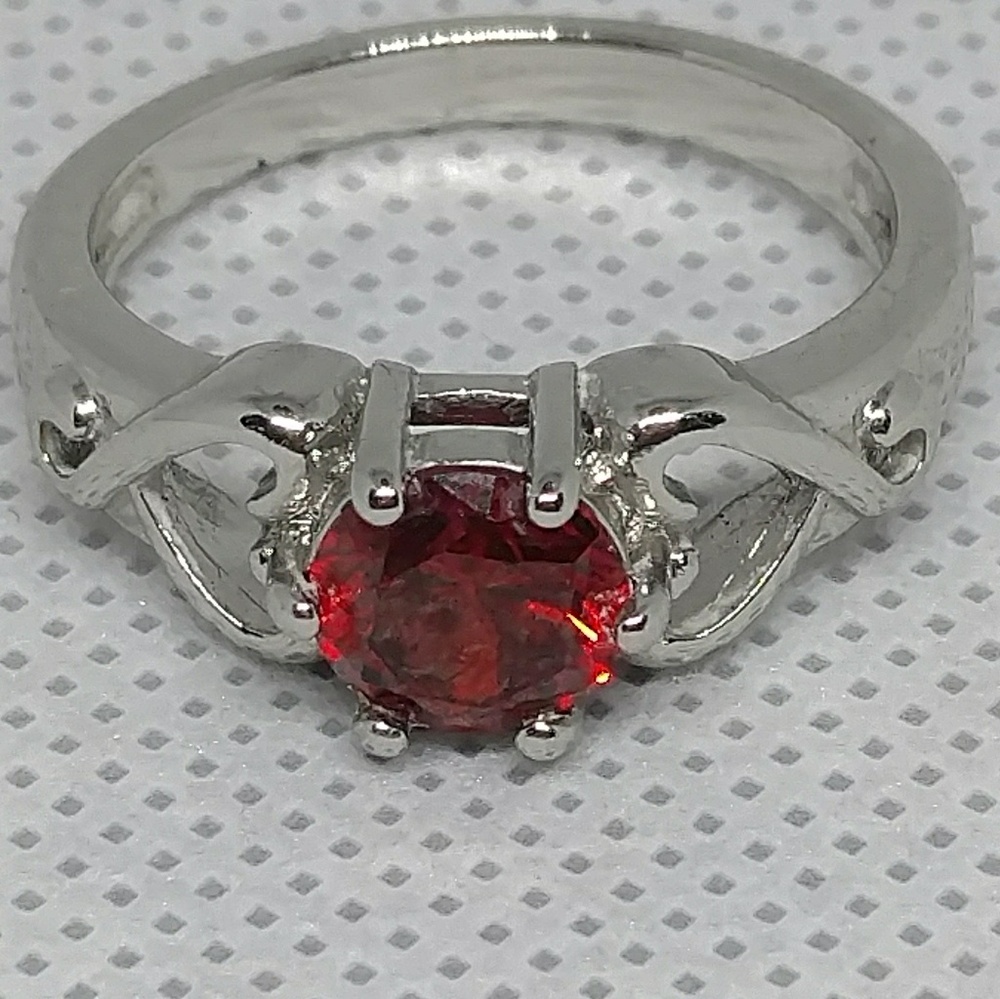 Garnet ring on silver tone setting size 8/ 8.25